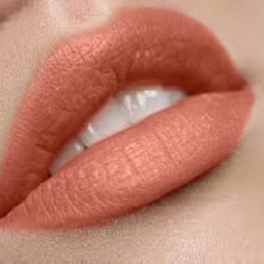 By The Clique Sun Kissed lip color on lips in peach nude with long-lasting effect