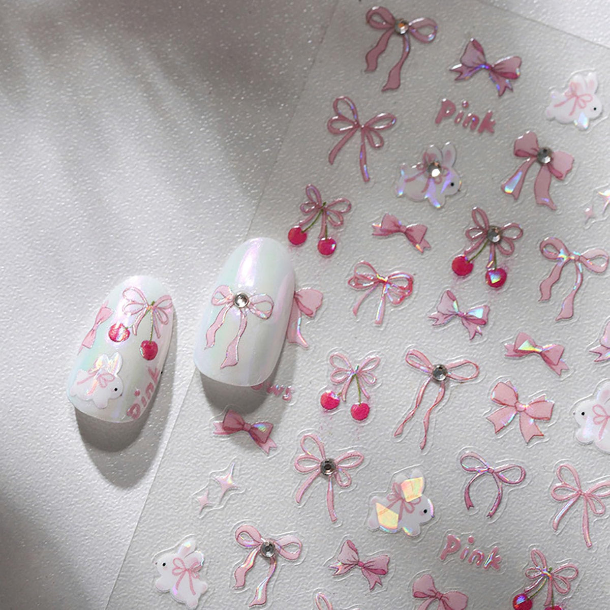 BYJKYEN Bow Nail Art Stickers glitter pink on natural nails for an easy glam look.