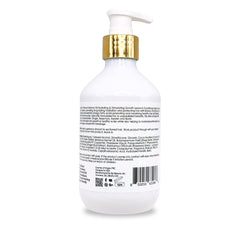 Applying By Natures Batana Oil Leave-In Conditioner to damp hair for smoother, frizz control.