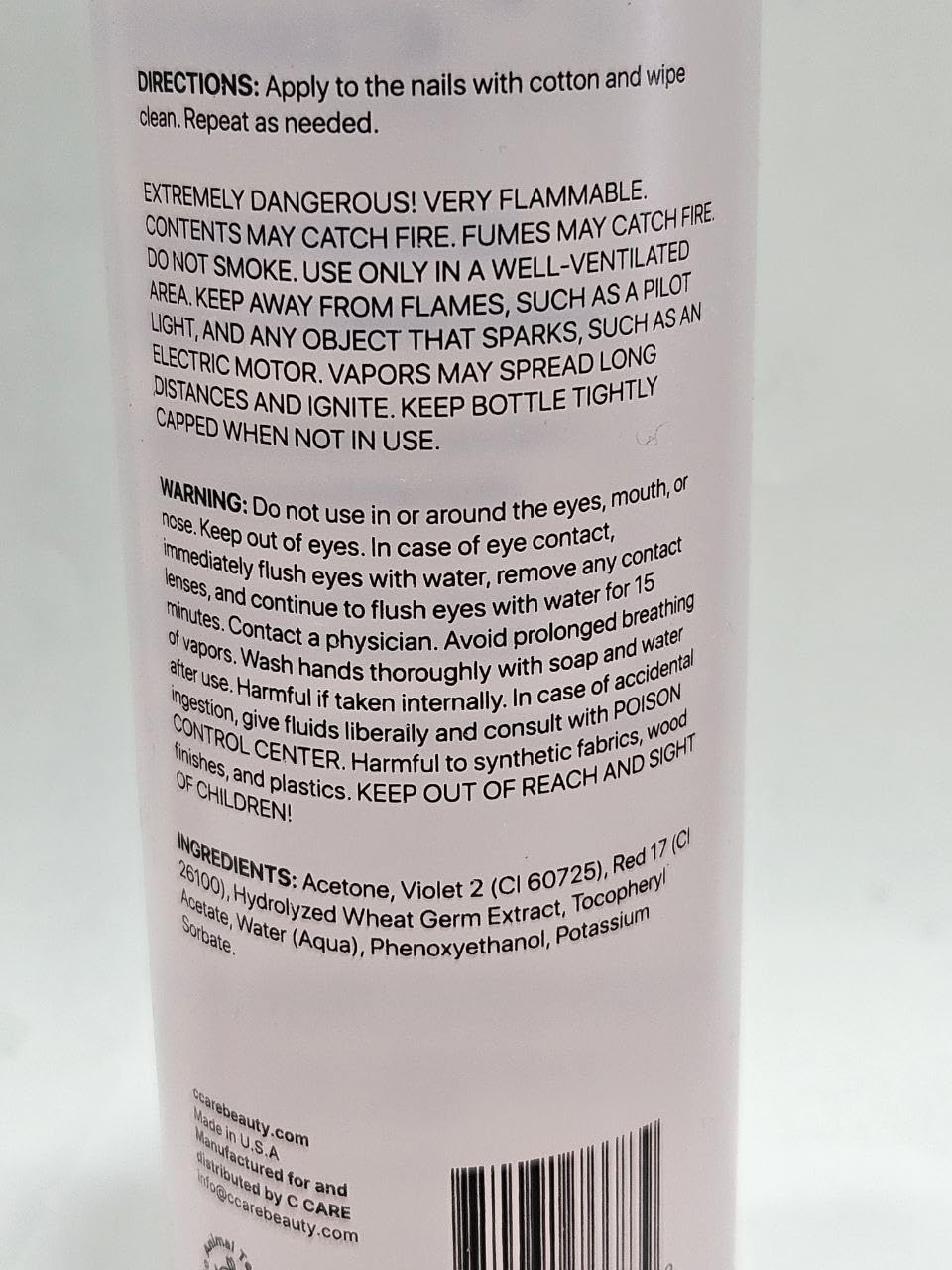 C CARE Nourishing Acetone Nail Polish Remover pouring into cotton pad for efficient removal.