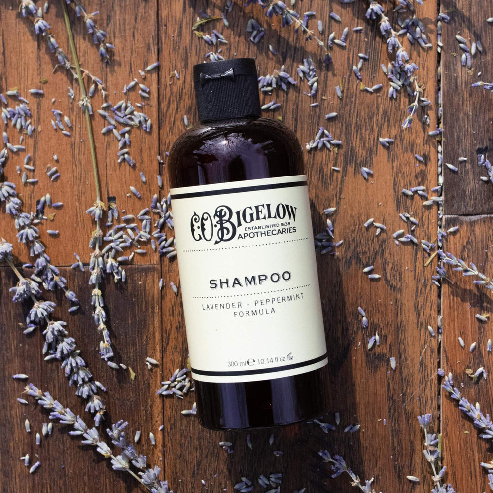 Lavender flowers beside the bottle highlighting calming aroma and spa-like shower.