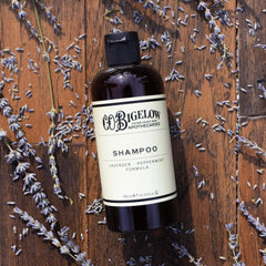 Lavender flowers beside the bottle highlighting calming aroma and spa-like shower.