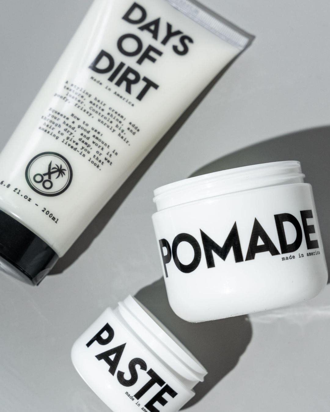 California Born Days of Dirt hair cream on travel tube, ready for on-the-go styling.