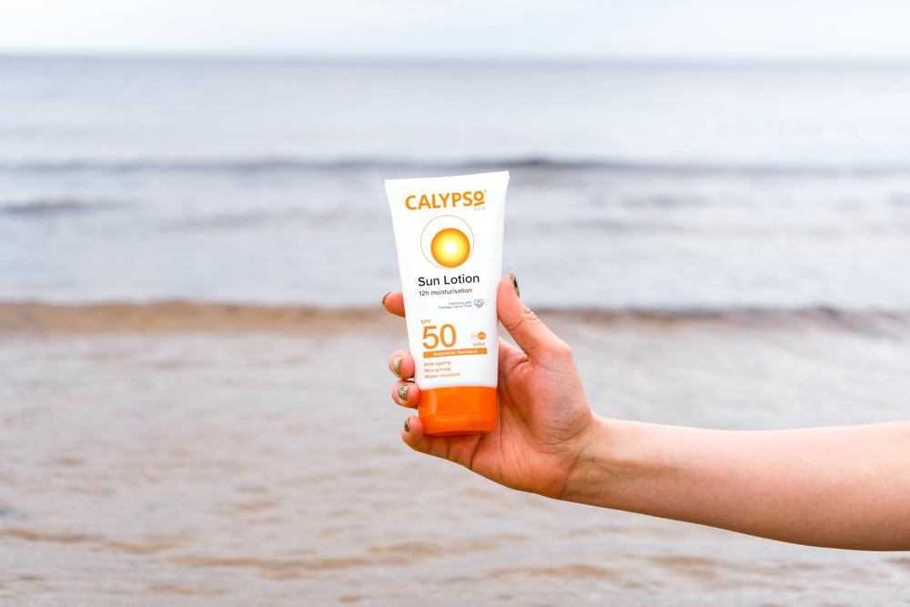 Calypso Linco Care Sun Lotion outdoors with family, emphasizing long-lasting sun care.