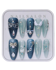 CAMILCY Almond Catseye nails with blue diamonds for a salon look at home