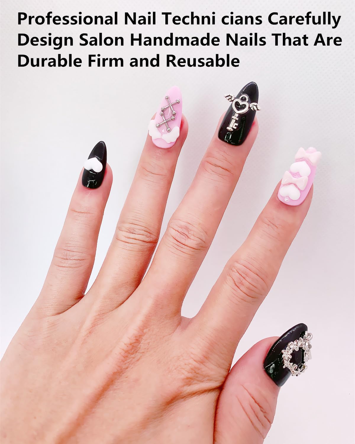 CAMILCY nails with black pink diamonds for bold sparkle