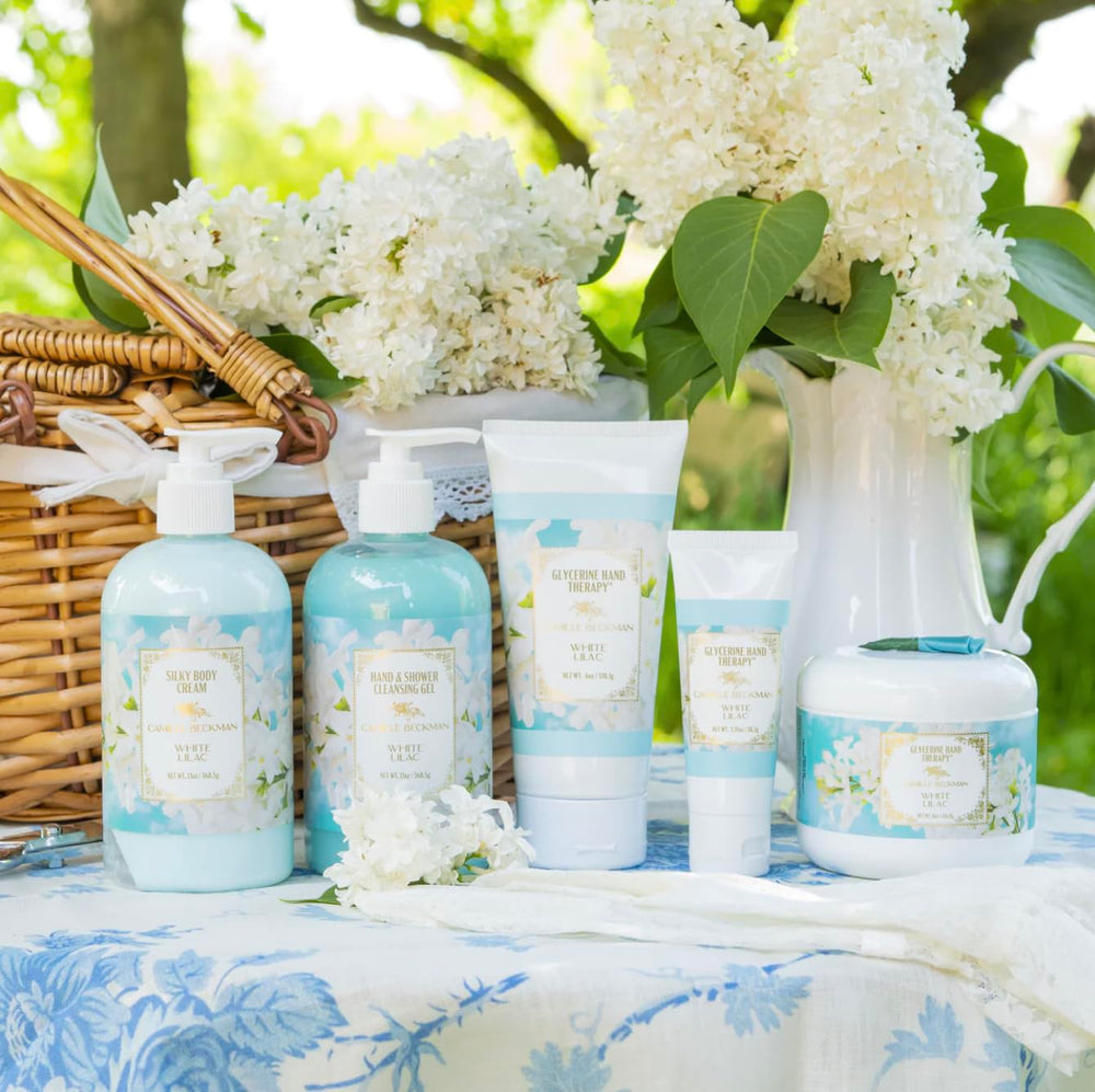 Camille Beckman hand cream texture shown during application on hands