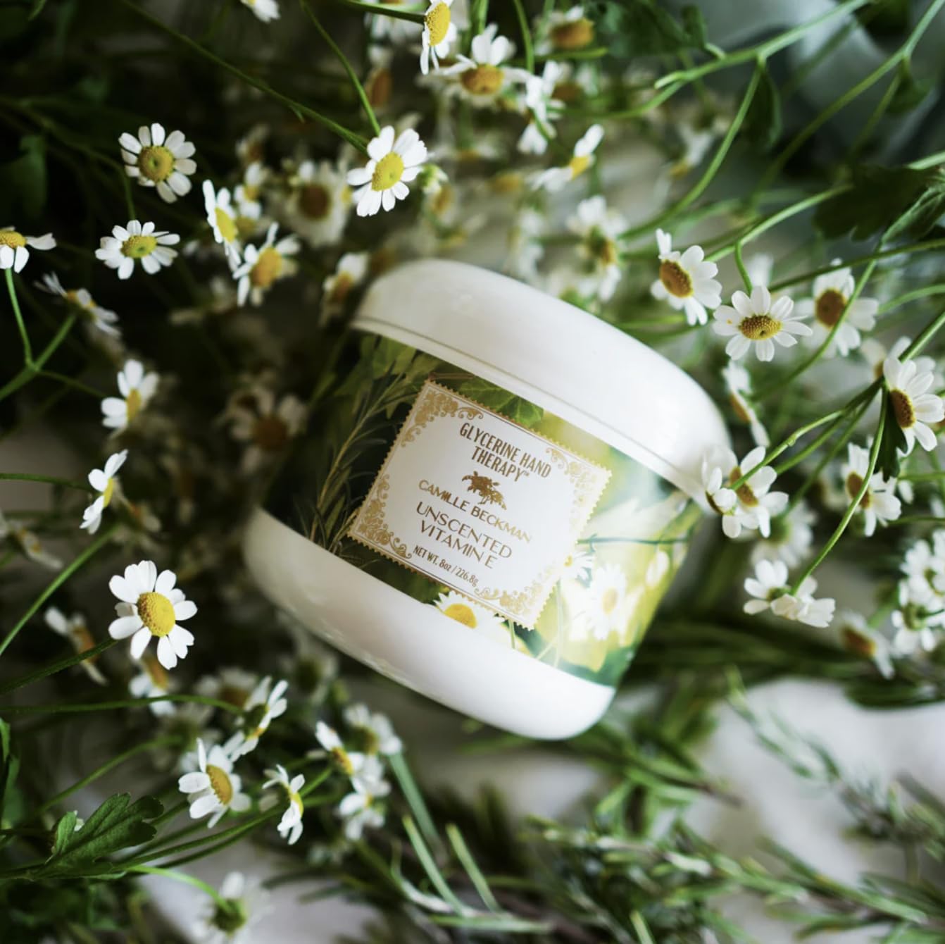Camille Beckman hand therapy cream jar closeup highlights rich texture for comfort
