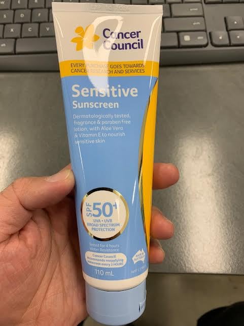 Cancer Council SPF50+ sunscreen texture close-up for smooth fragrance-free protection.