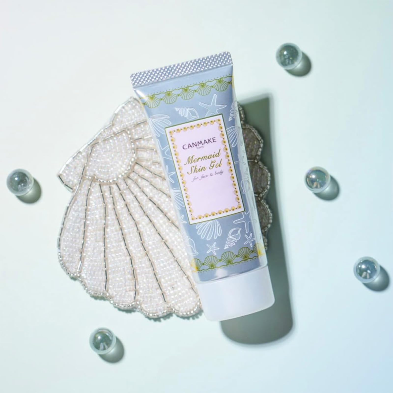 CANMAKE Mermaid Skin Gel application close-up shows easy-use pump design.