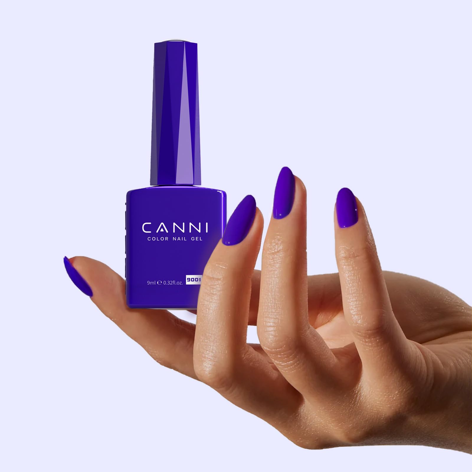 CANNI Royal Blue gel polish with base coat applied on nails, reinforced color.
