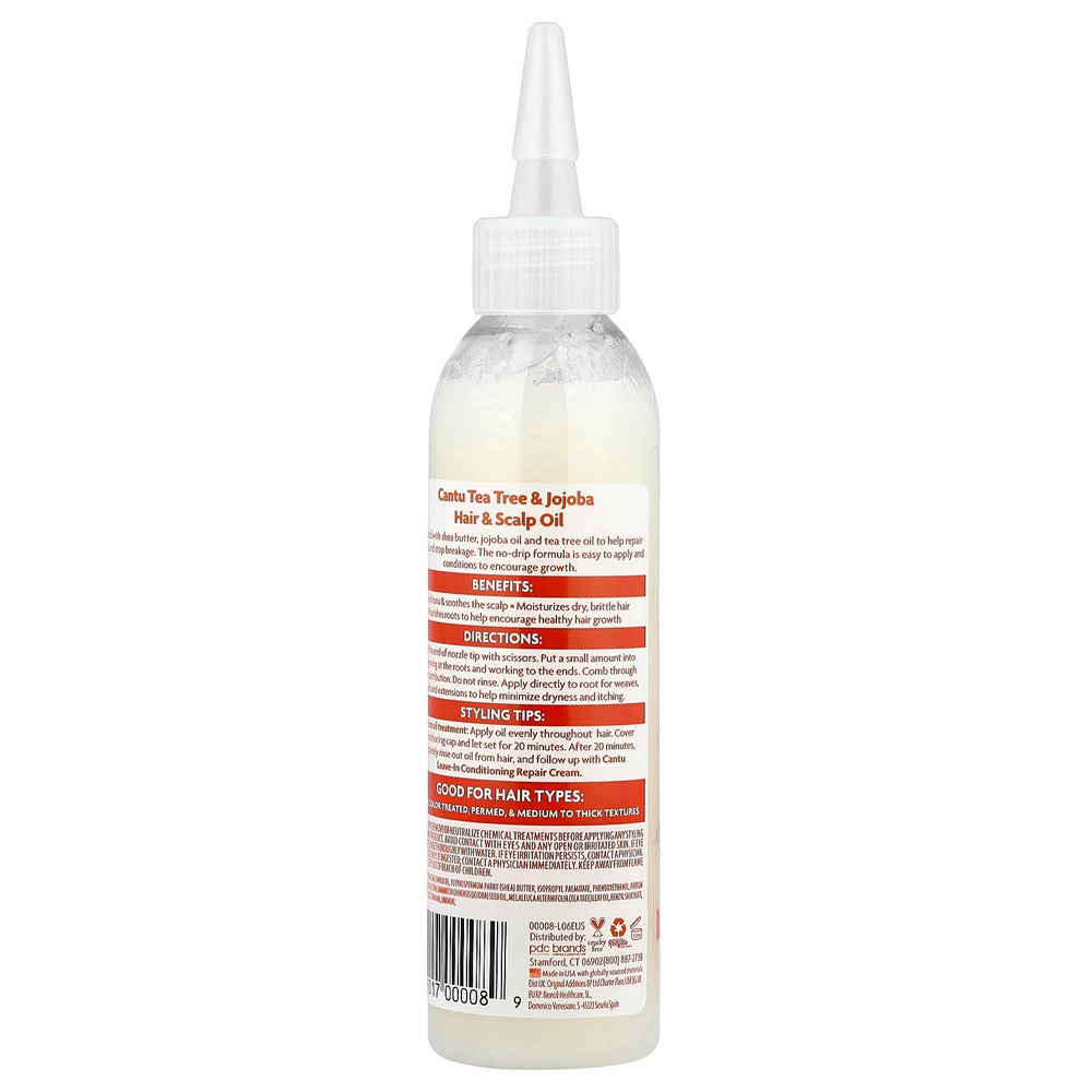 Cantu No Drip Oil applied to scalp for nourished feel.