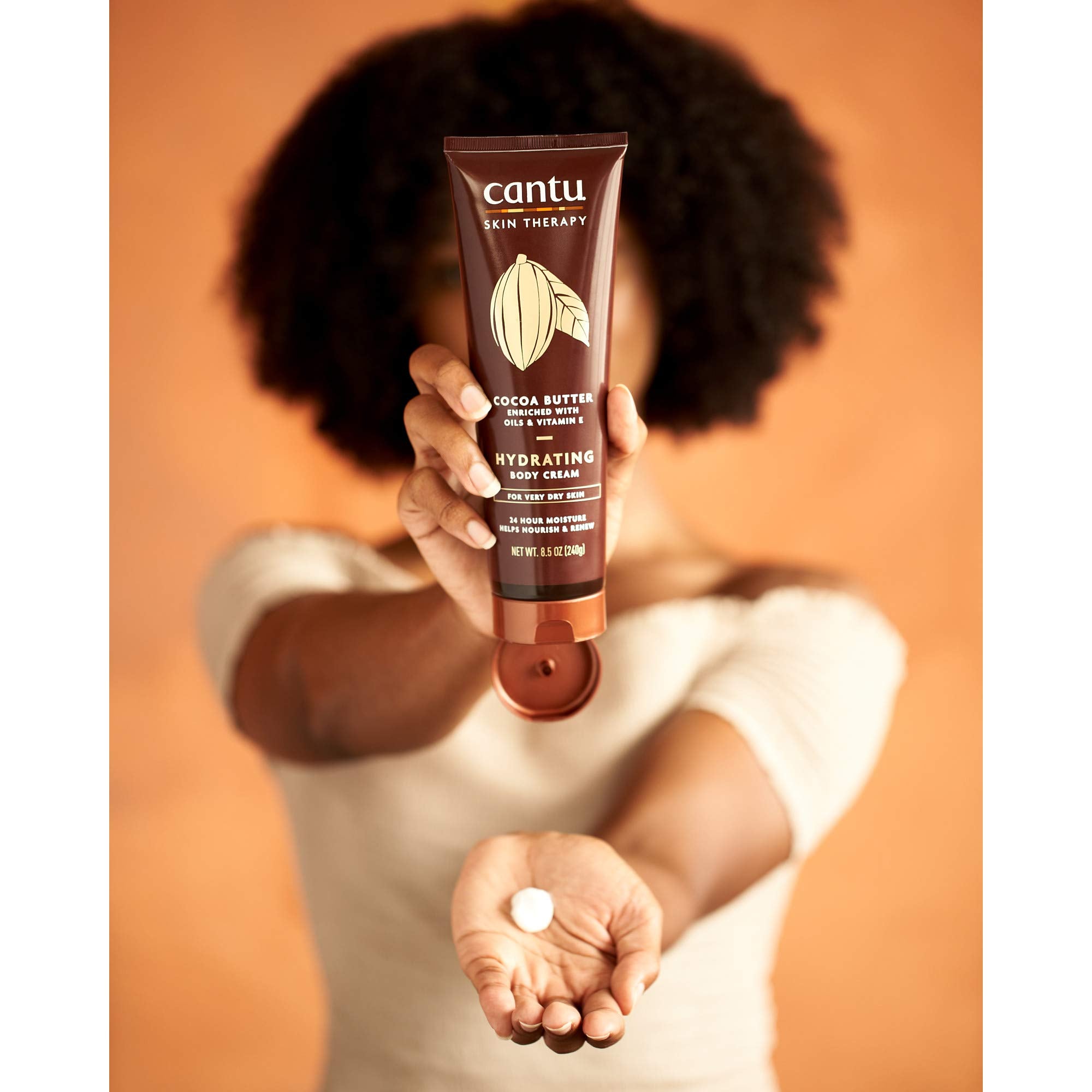 Packaging shot of Cantu Therapy Cocoa Butter Body Cream in tub.