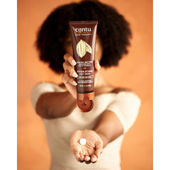 Packaging shot of Cantu Therapy Cocoa Butter Body Cream in tub.