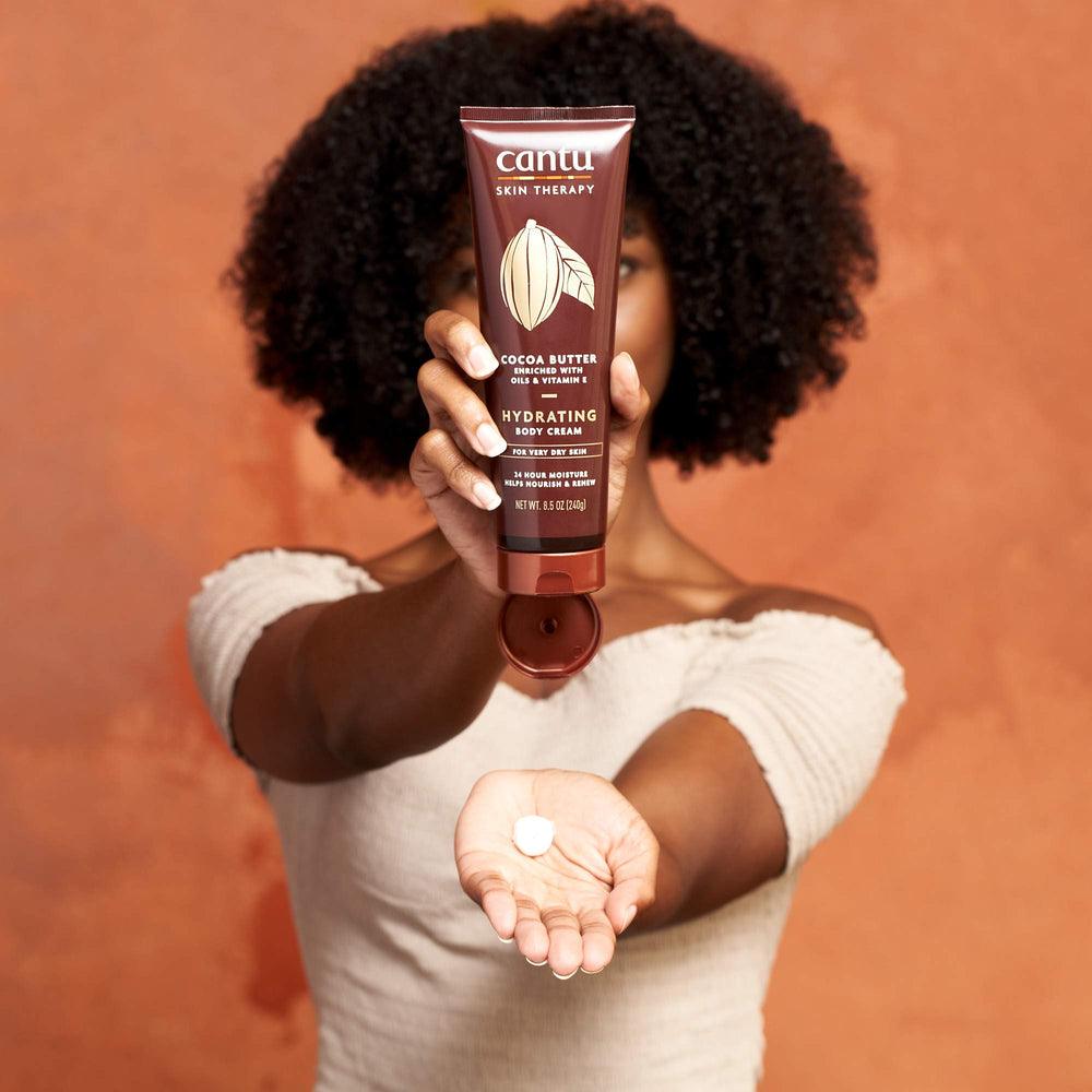 Daily body care routine with Cantu Therapy Cocoa Butter Cream.