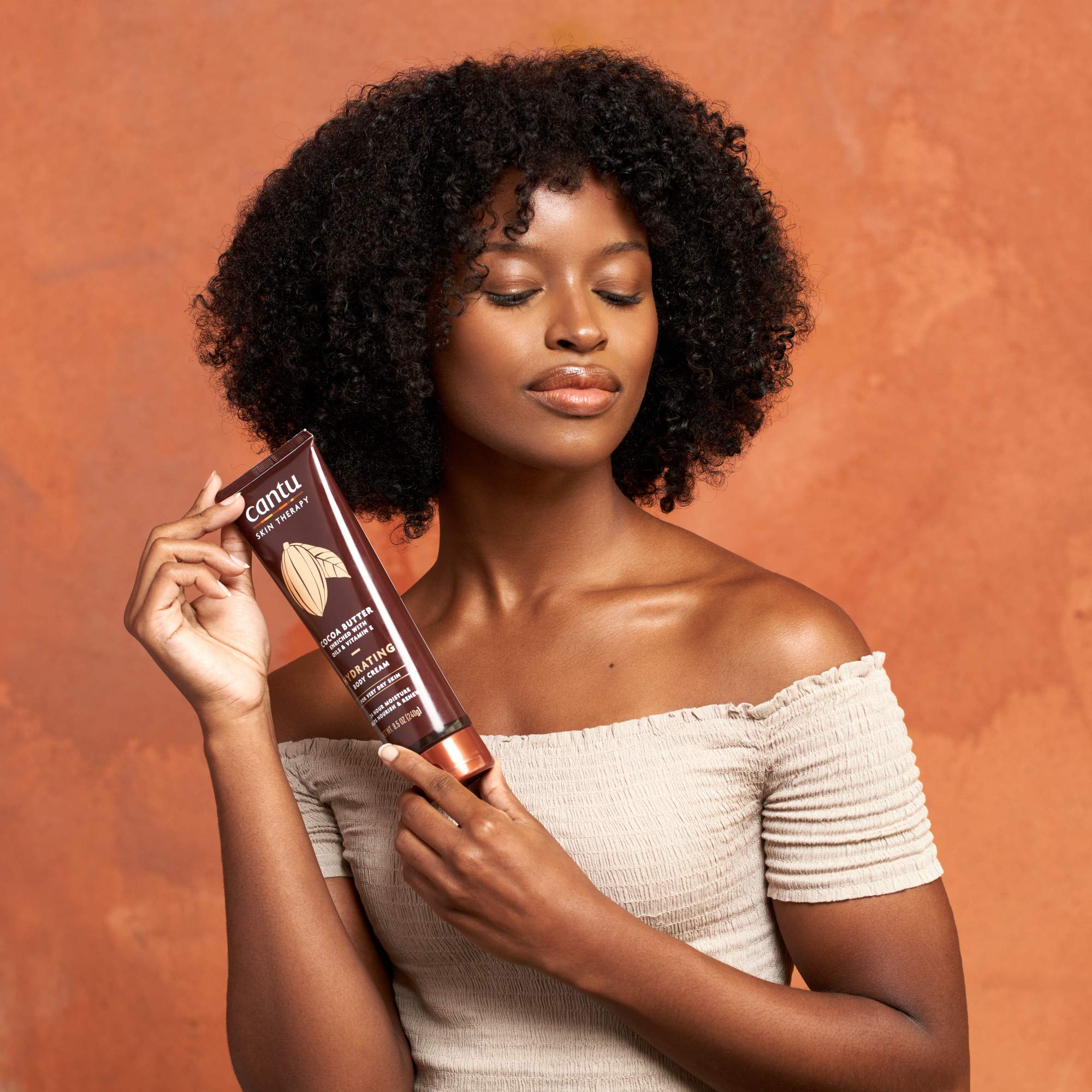 Natural ingredients like cocoa butter and Vitamin E in Cantu Cream.