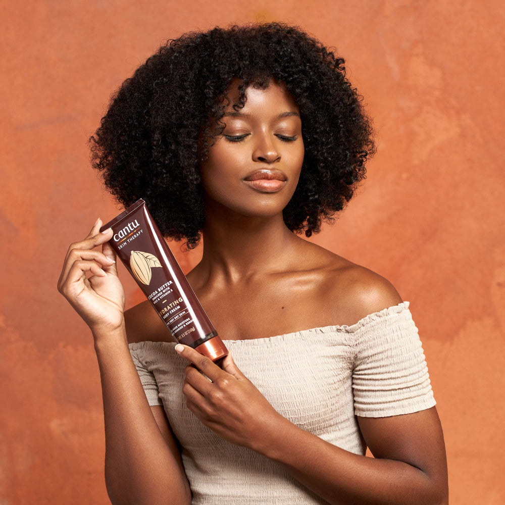 Natural ingredients like cocoa butter and Vitamin E in Cantu Cream.