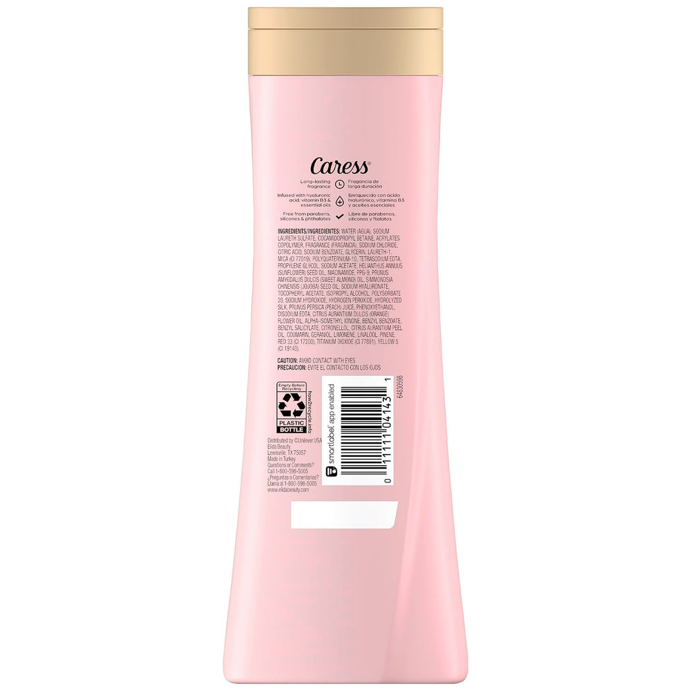 Caress body wash bottle close-up highlighting hydrating formula for silky skin.