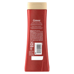 Caress Tahitian Pomegranate & Coconut Milk lather shows creamy foam for refreshing wash.