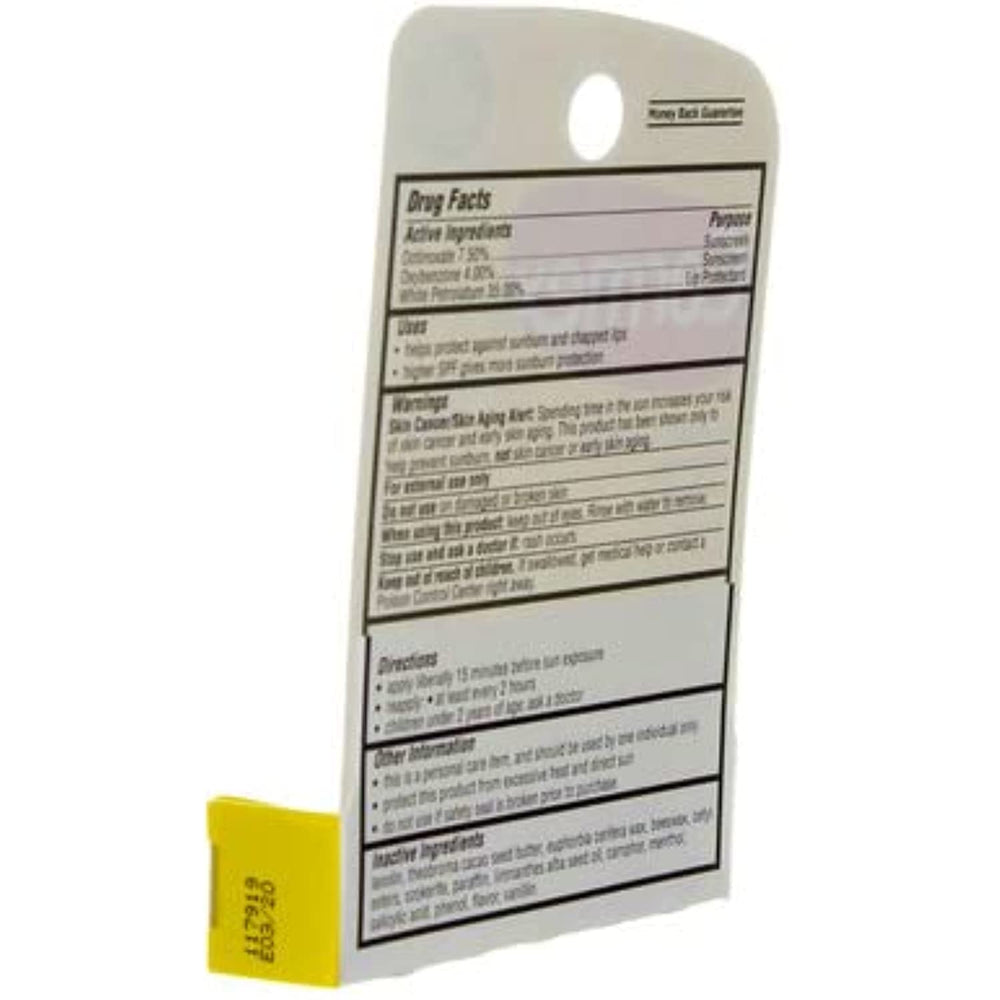 Carmex lip balm stick on white surface ready for reuse.