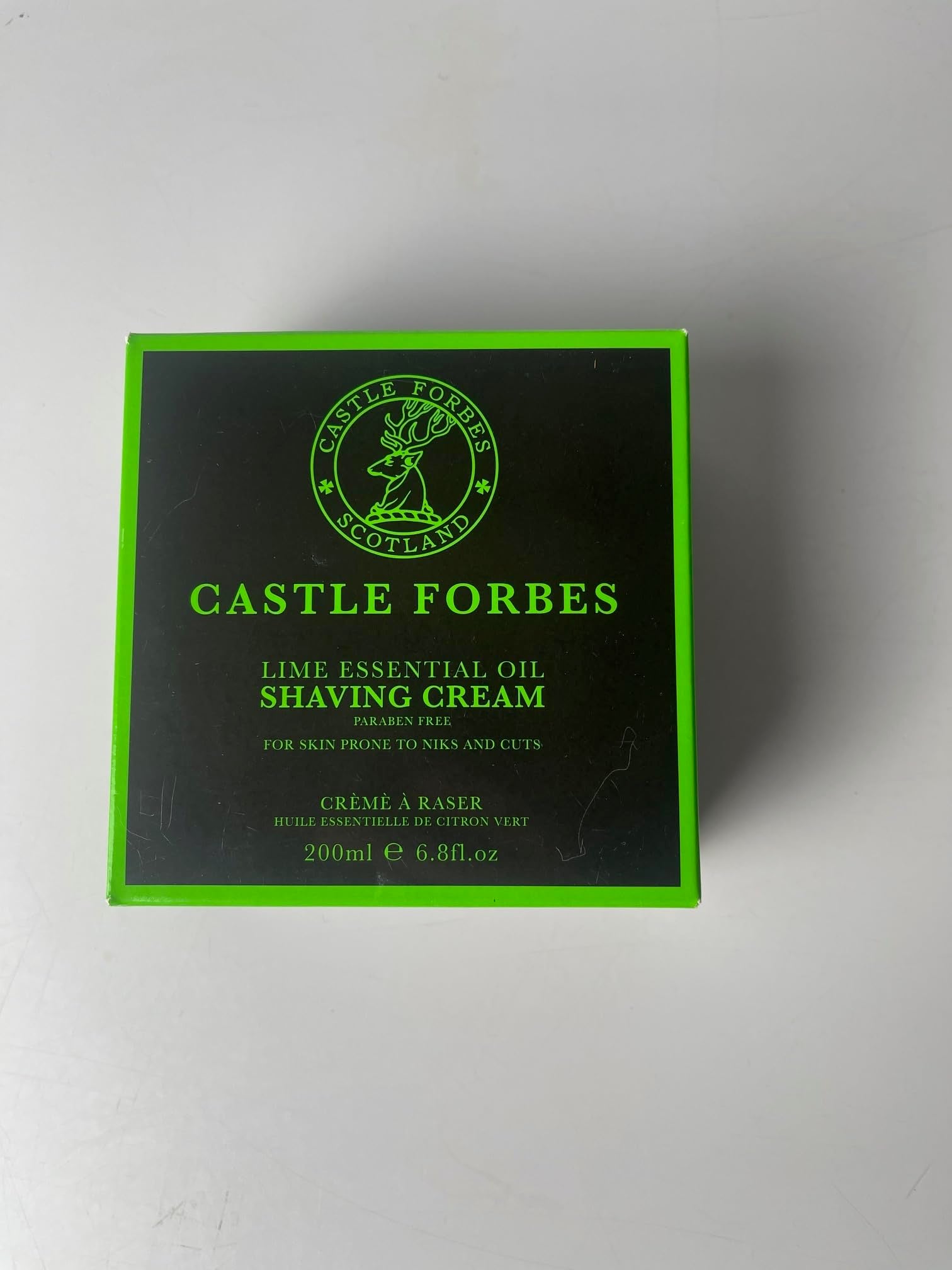 Castle Forbes Lime Shaving Cream label highlights essential oils benefits.