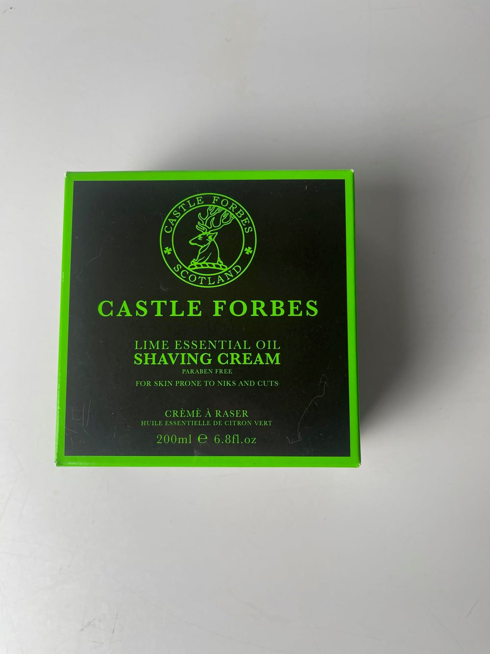 Castle Forbes Lime Shaving Cream label highlights essential oils benefits.
