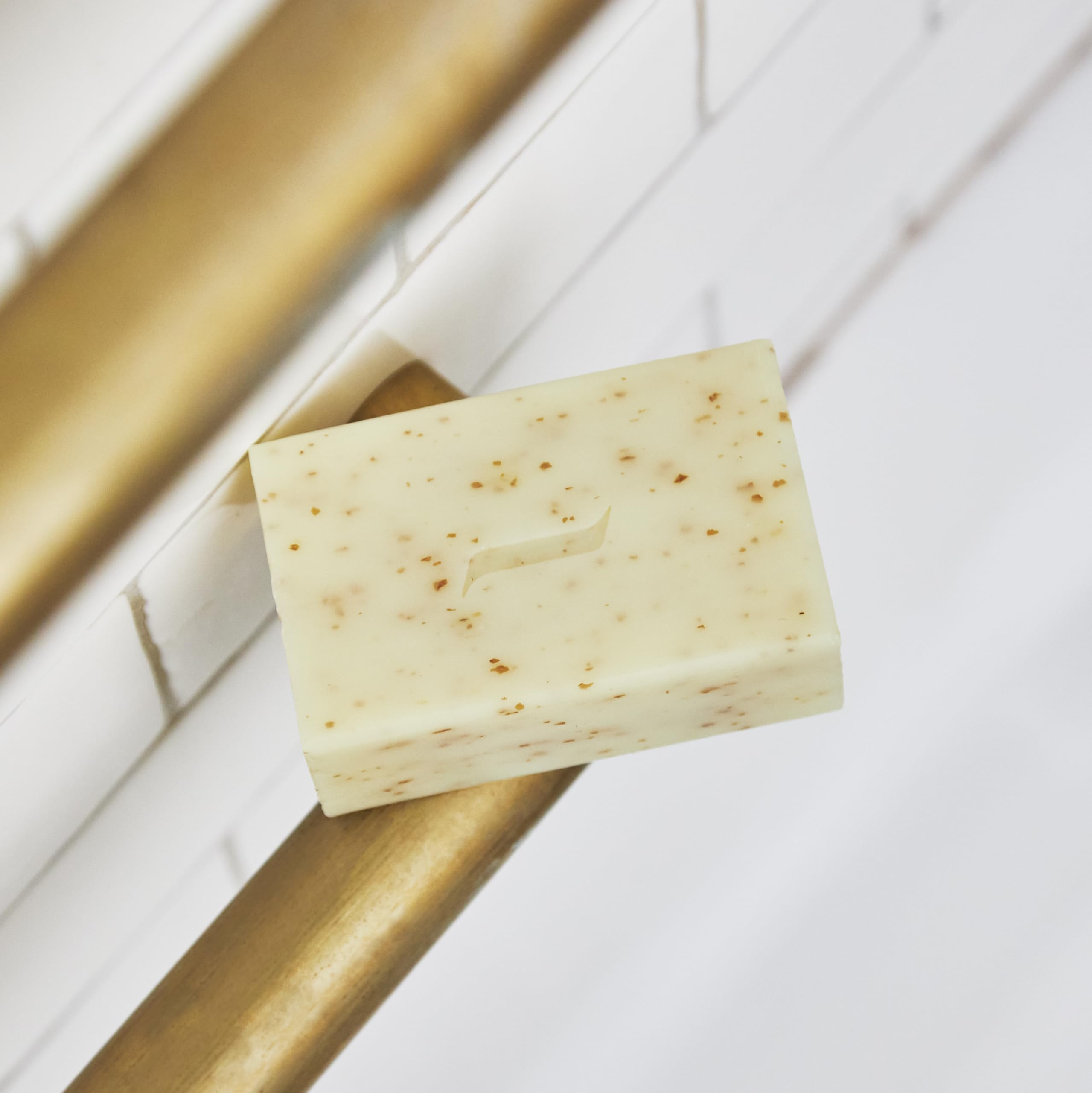 Caswell-Massey Heritage Body Scrub detail highlights grapefruit peel accents.