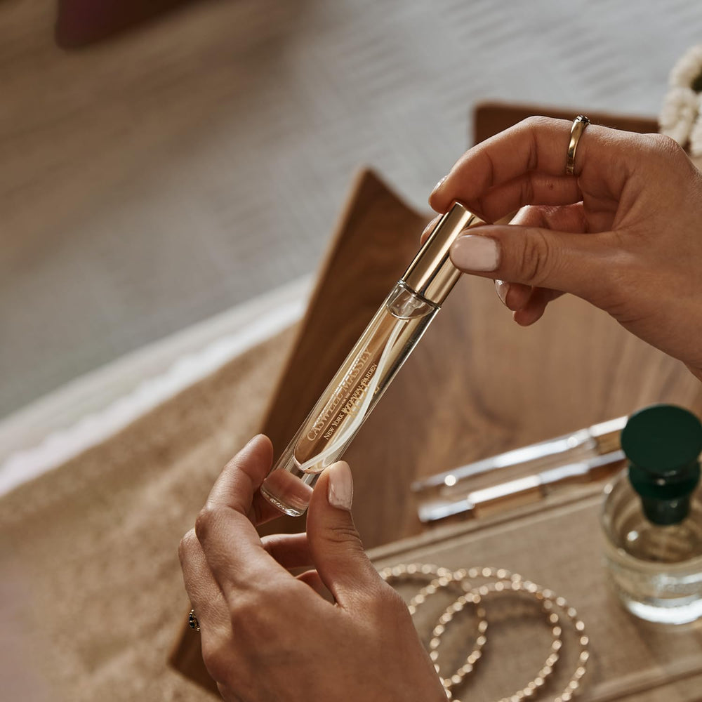 Caswell-Massey Orchid Perfume Spray droplets ready for subtle on-skin application