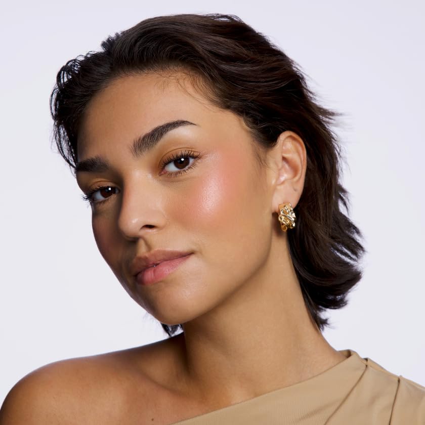 Powder blush applied with a fluffy brush for seamless dimension