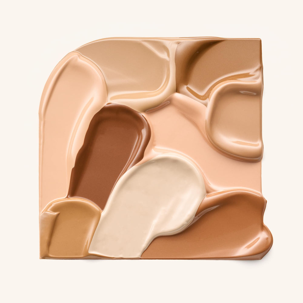 Catrice Soft Glam Filter Fluid highlighter on cheek for natural radiance.