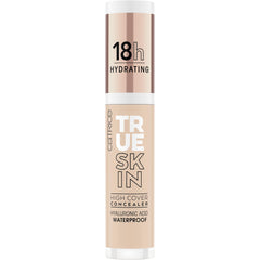 Creamy concealer swirled on skin for a natural matte look with 010 Cool Cashmere shade.