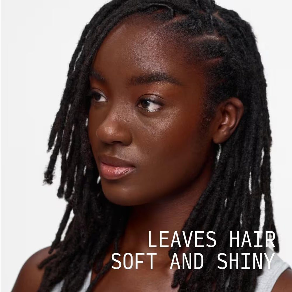 Cécred Nourishing Hair Oil application on hair demonstrating smooth texture and manageability.