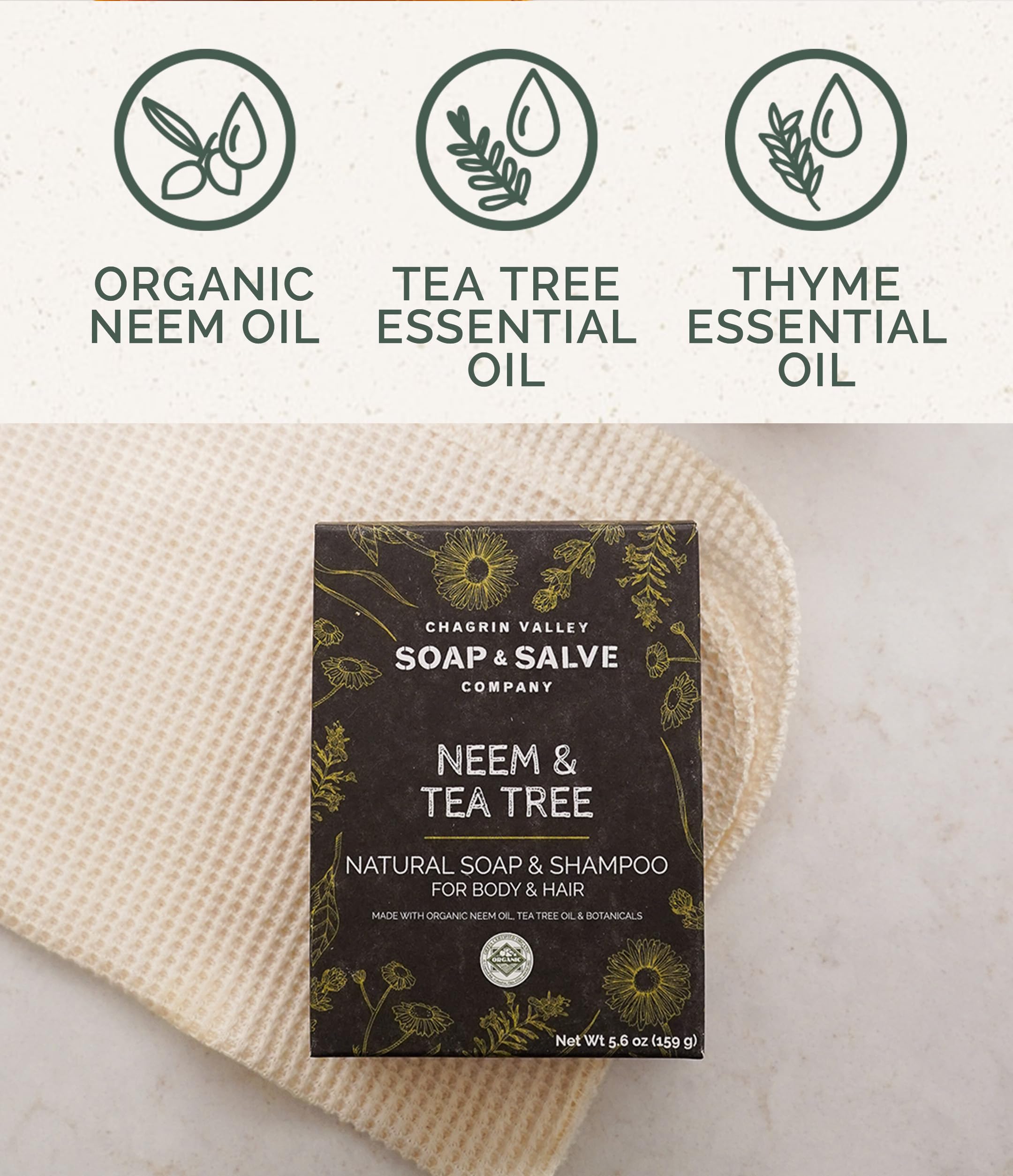 Chagrin Valley Neem & Tea Tree bar lather forming on a washcloth for cleansing.