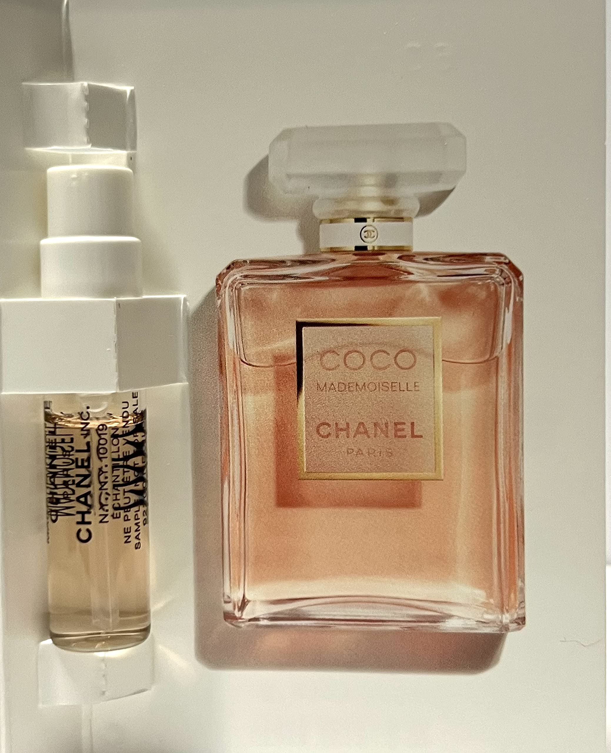 CHANEL Coco Mademoiselle vial cap closeup highlighting luxury detail and portability.