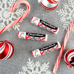Holiday edition ChapStick packaging beside balm for gifting