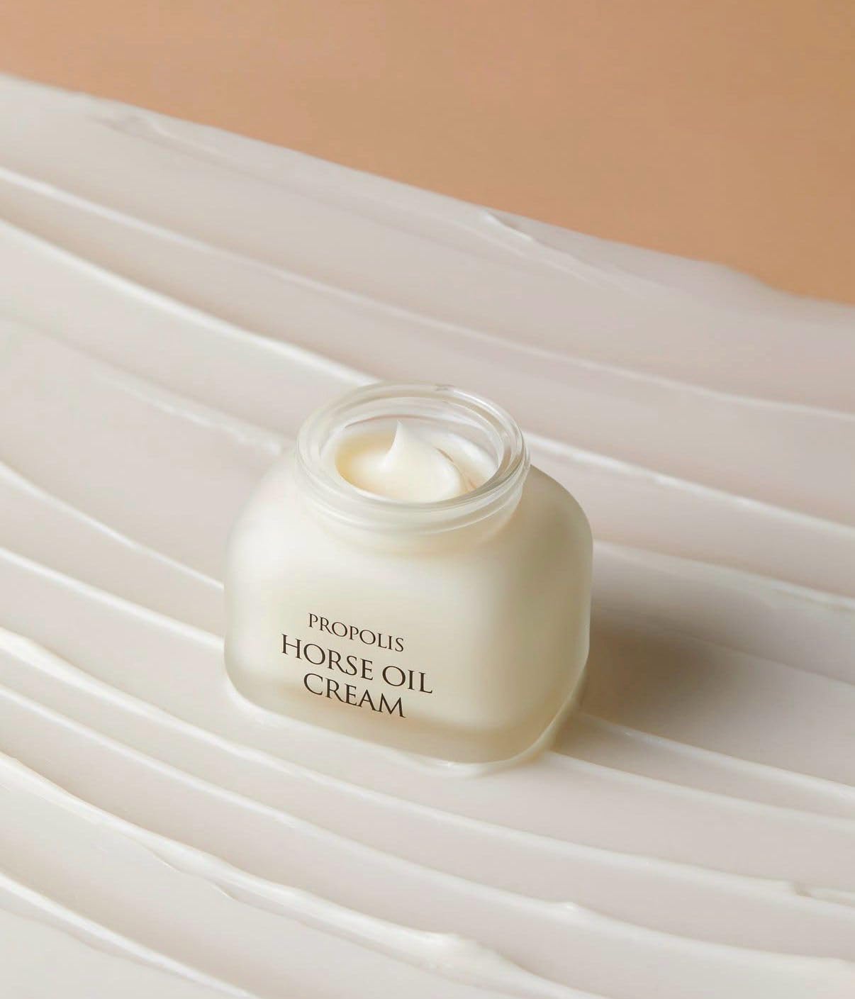 CHARMZONE Propolis Horse Oil Cream texture close-up reveals whipped, non-greasy finish for quick absorption.