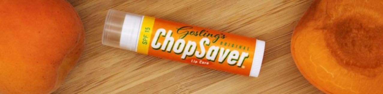 Applying Goslings Original lip balm to lips for immediate moisture.