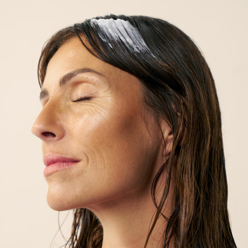 Christophe Robin Color Shield Cleansing Mask macadamia oil nourishes lengths for soft shine.
