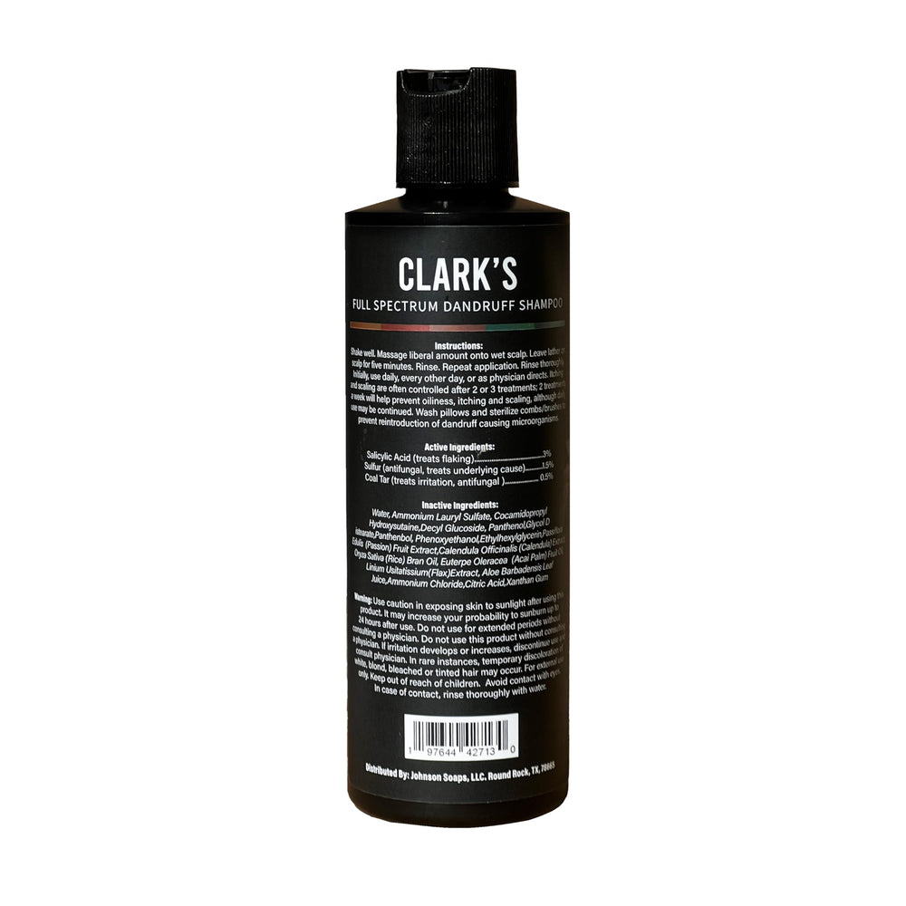Clark's Full Spectrum Dandruff Shampoo bottle side label shows actives for informed use and scalp care.