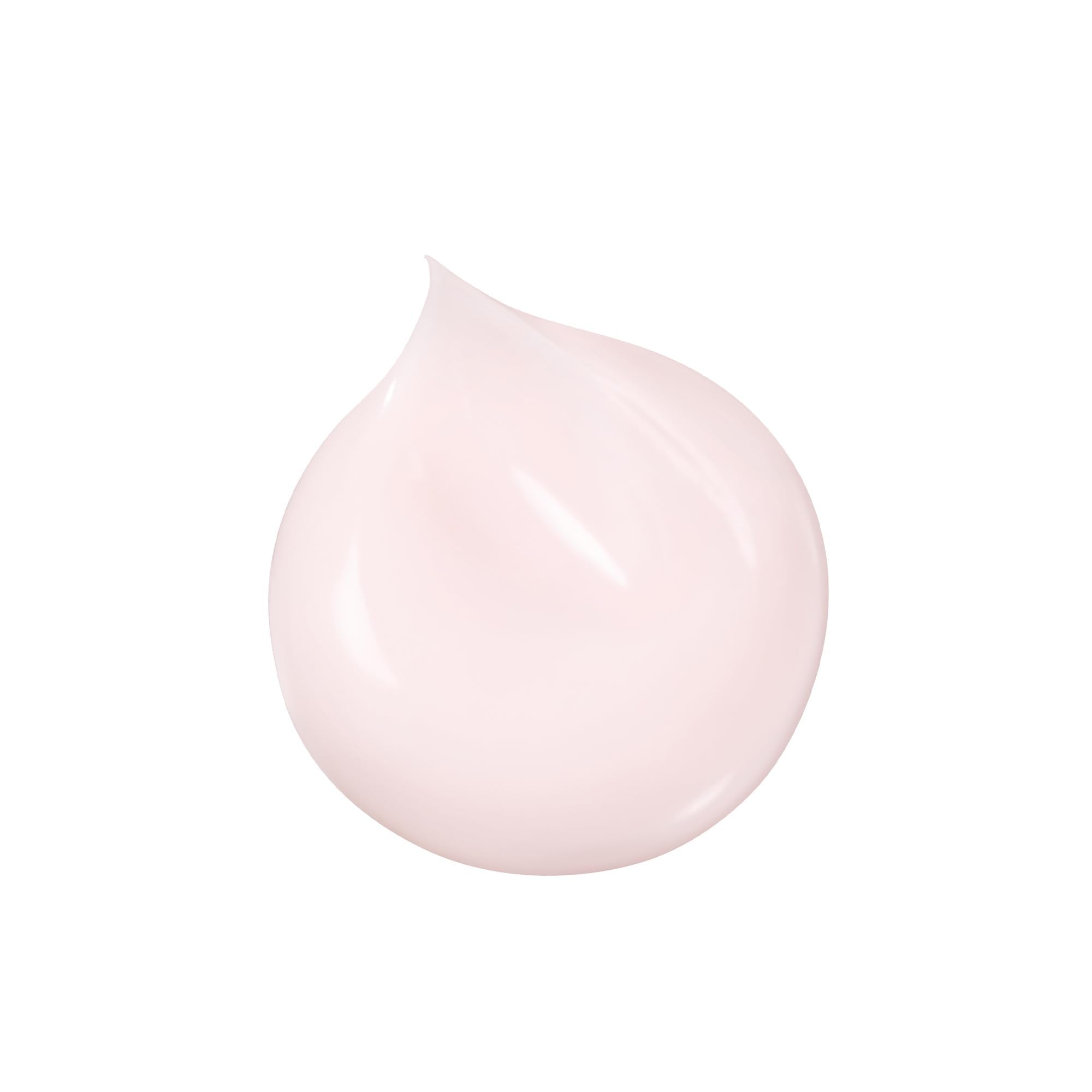 Clé de Peau Beauté Advanced Night Cream pump bottle during night routine, smooth application.