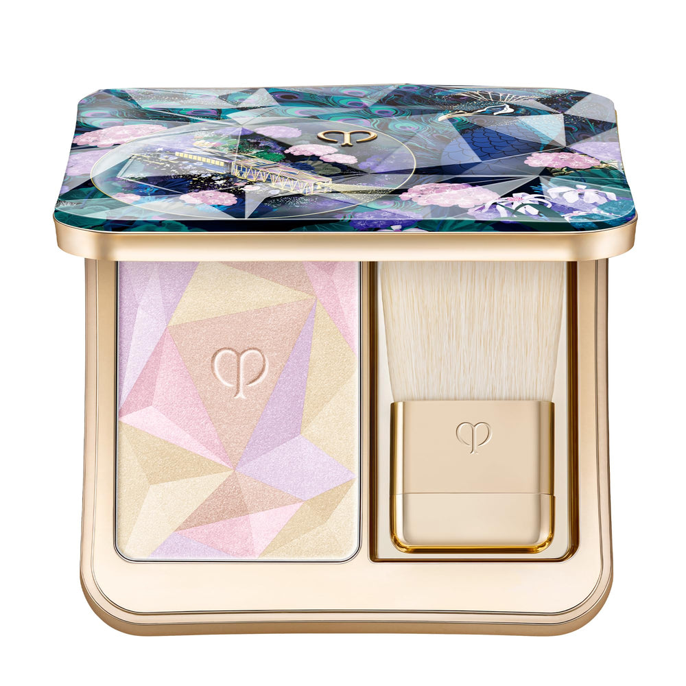 Clé de Peau Beauté Luminizing Face Enhancer 110 compact with mirror for on-the-go touch-ups.