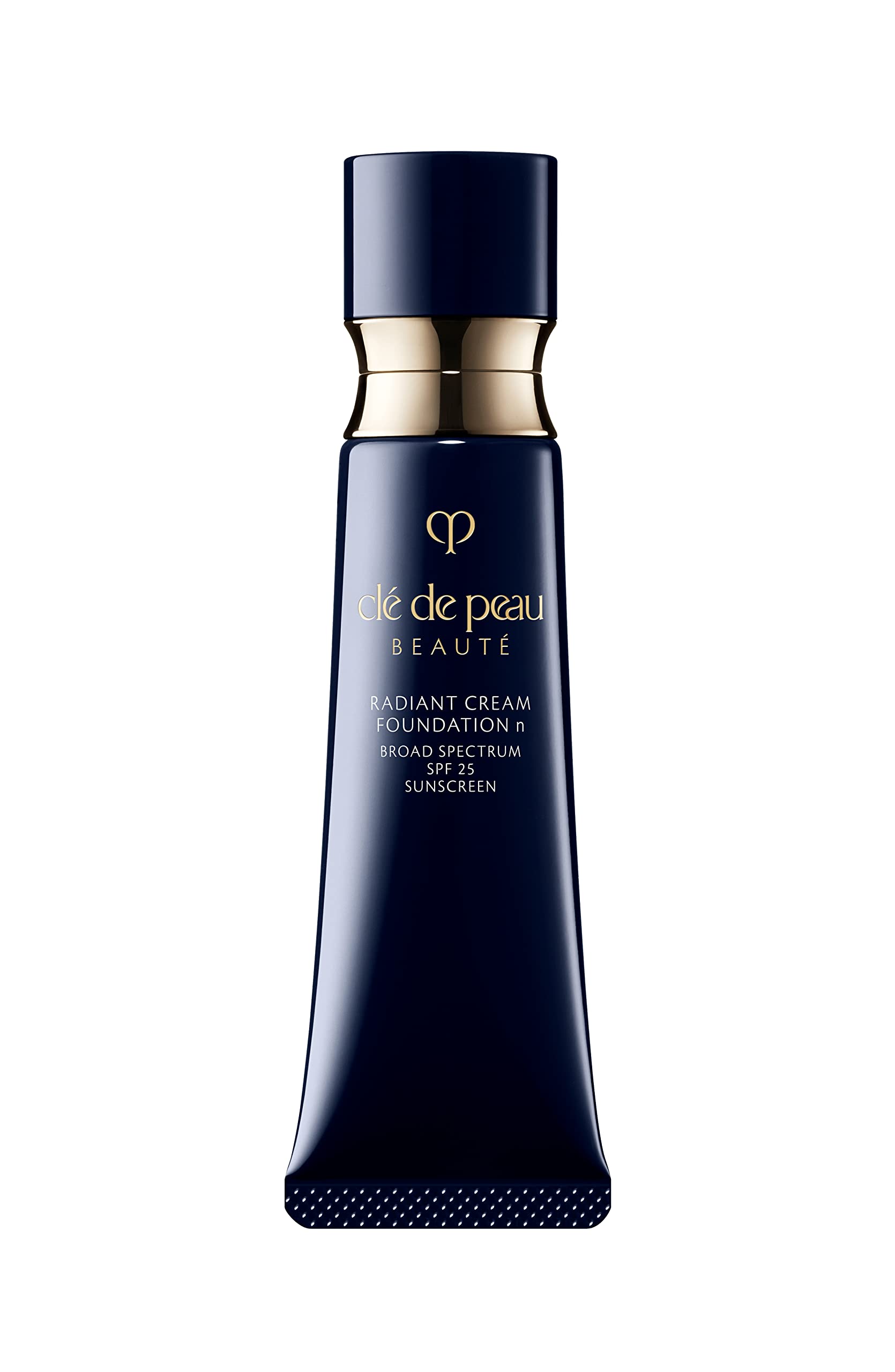 Clé de Peau Beauté Radiant Cream Foundation bottle with visible dewy finish and SPF 25 protection.