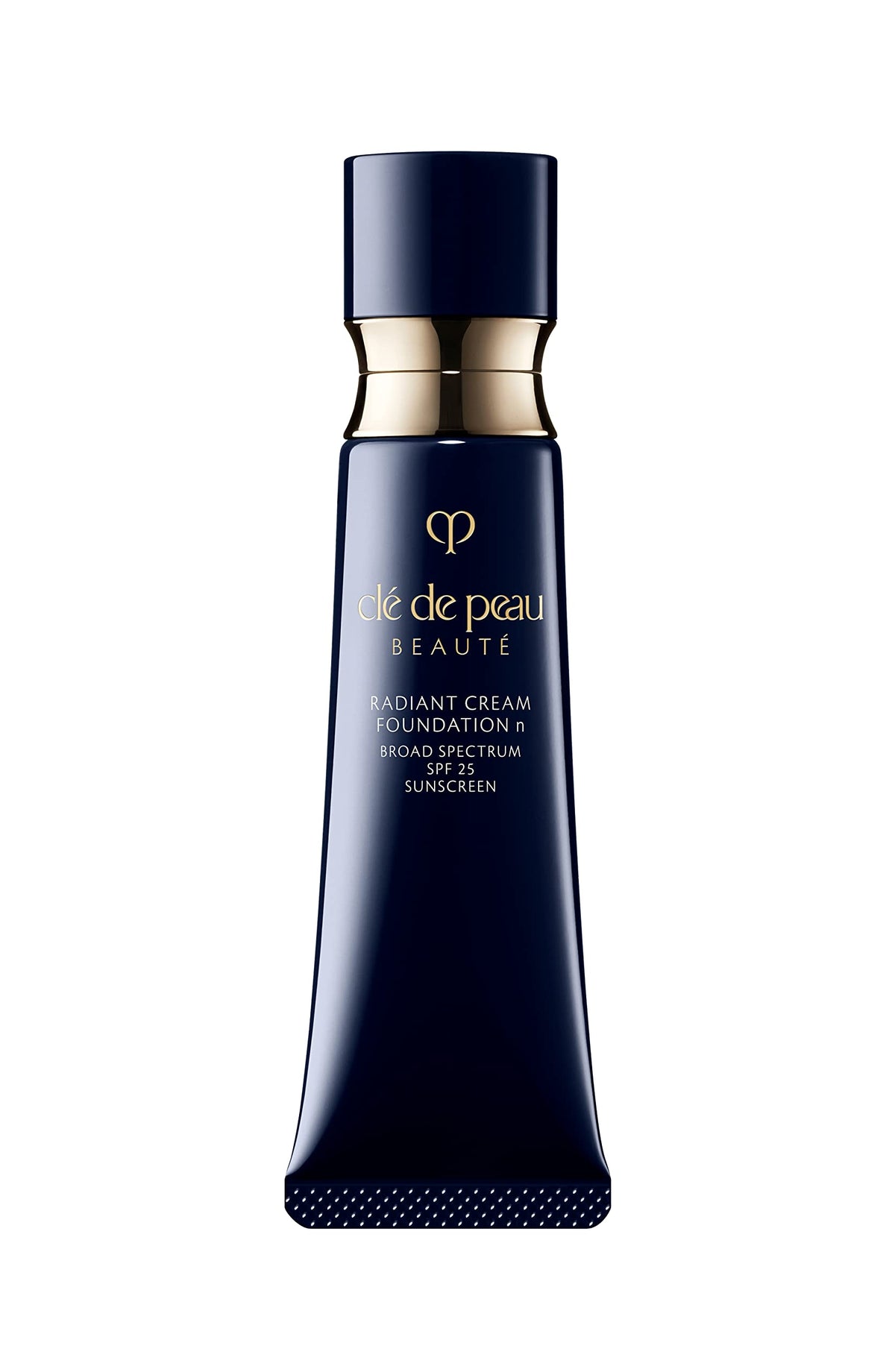 Clé de Peau Beauté Radiant Cream Foundation bottle with visible dewy finish and SPF 25 protection.