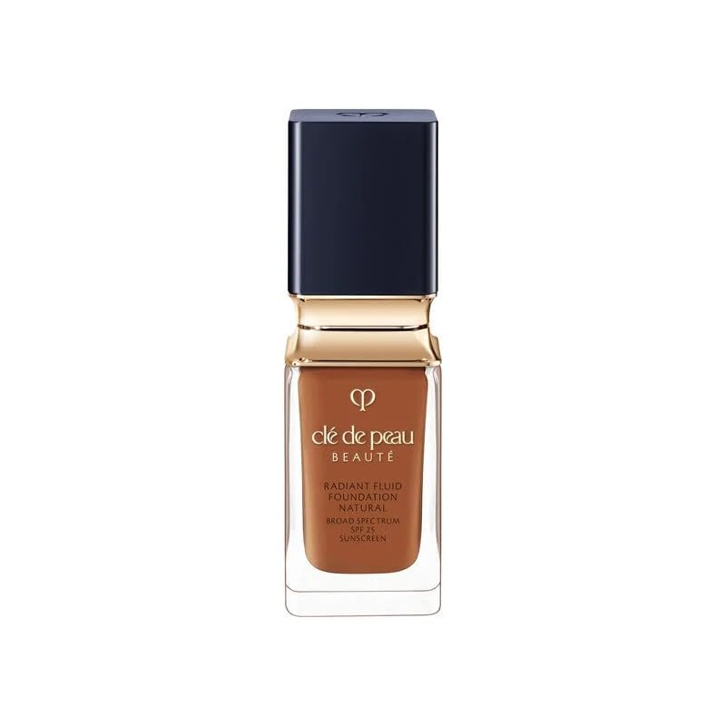 Clé de Peau Beauté Radiant Fluid Foundation bottle shows hydrating finish and 24-hour wear