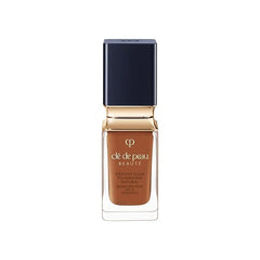 Clé de Peau Beauté Radiant Fluid Foundation bottle shows hydrating finish and 24-hour wear