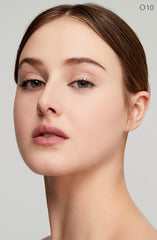 Clé de Peau Beauté Radiant Fluid Foundation luminous finish on skin with glow.