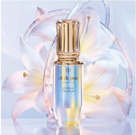 Clé de Peau Beauté The Serum bottle with pump demonstrating easy dosage for radiance