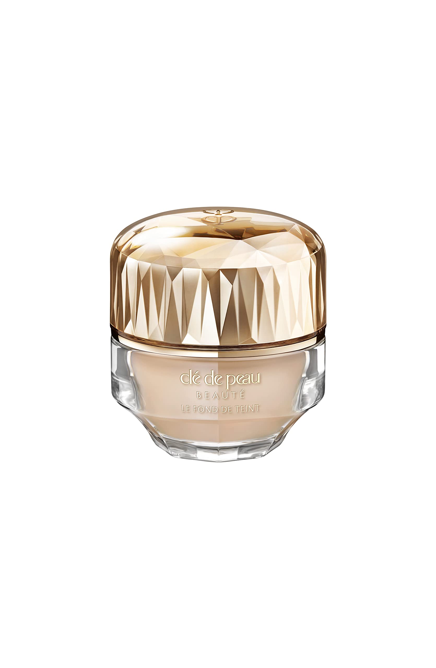 Clé de Peau Beauté foundation bottle close-up showing luxurious skincare-infused coverage