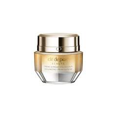Clé de Peau Beauté mini volumizing cream supreme bottle application shows premium texture and easy daily use.