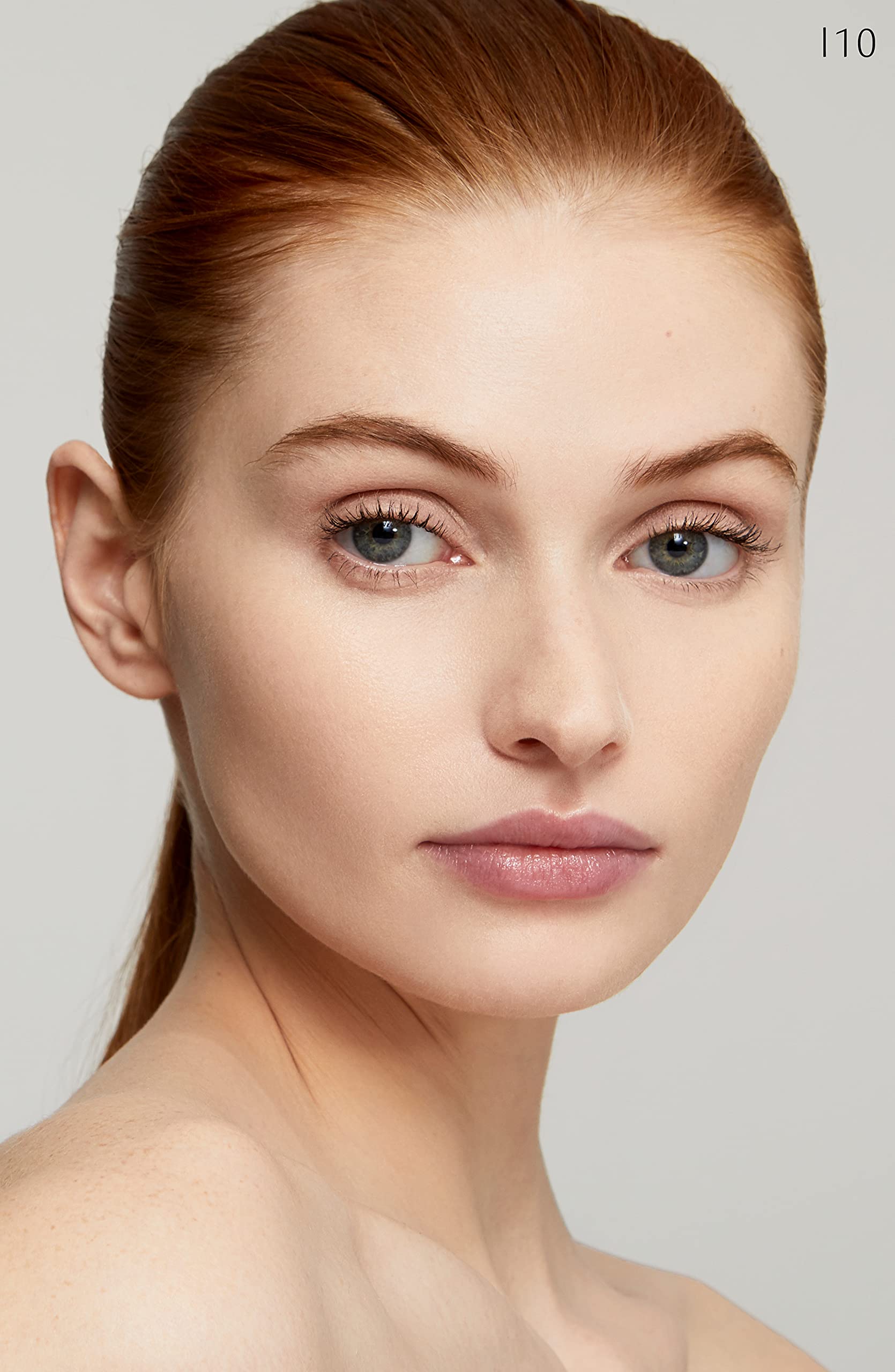 Clé de Peau Radiant Fluid Foundation applied with brush for a smooth, lightweight finish.